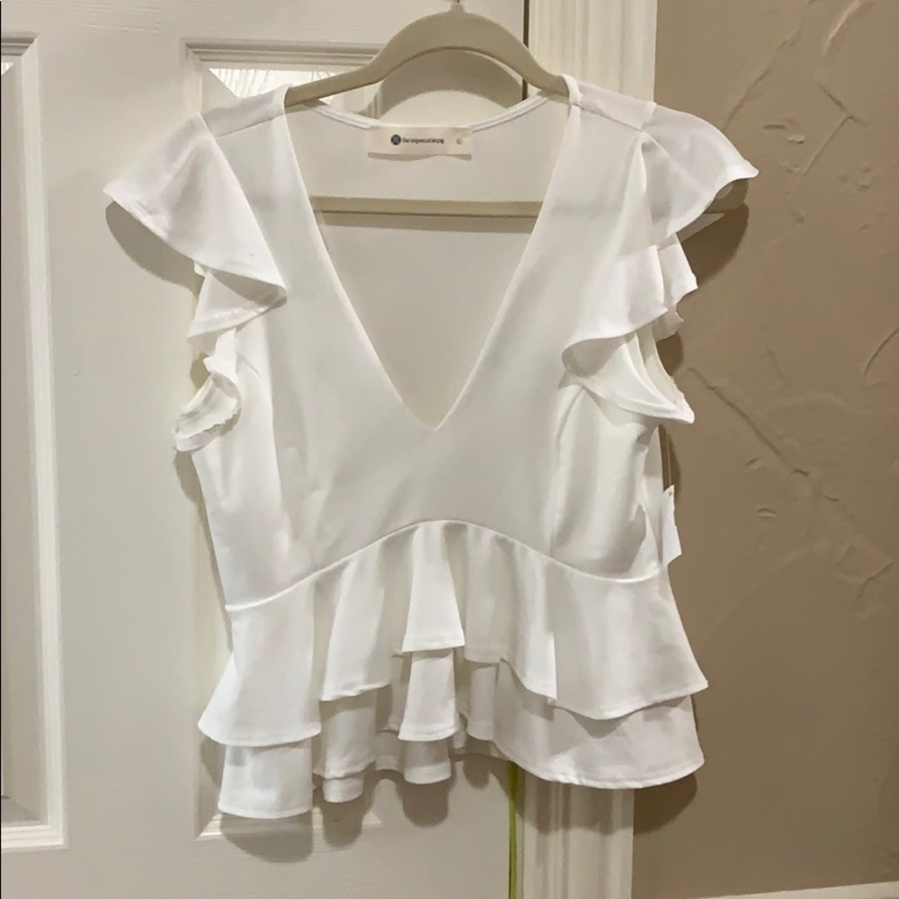 White ruffle top never worn